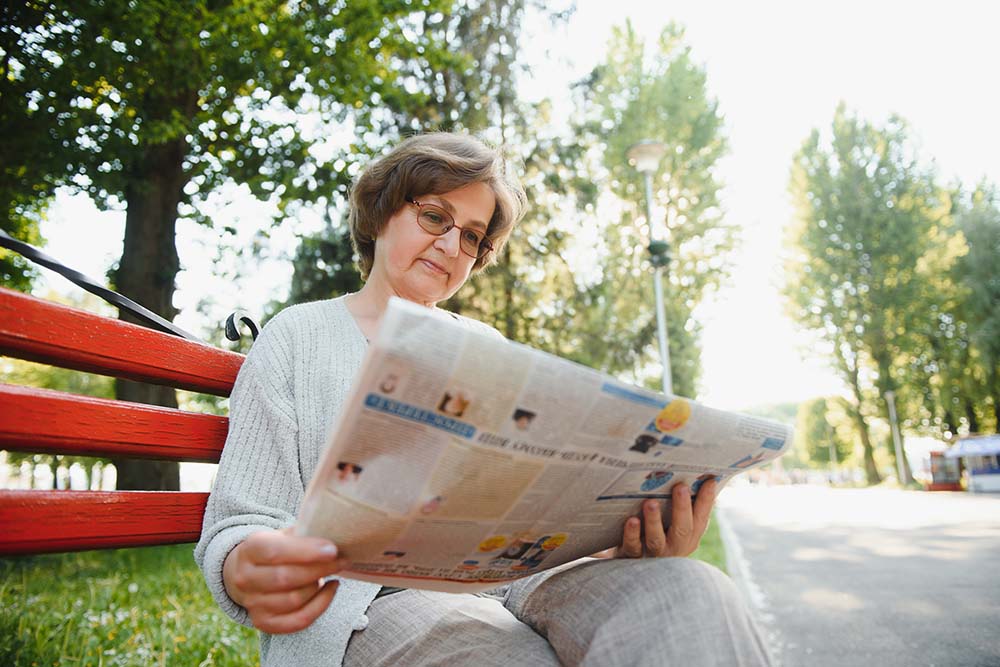 Lady Reading Newspaper